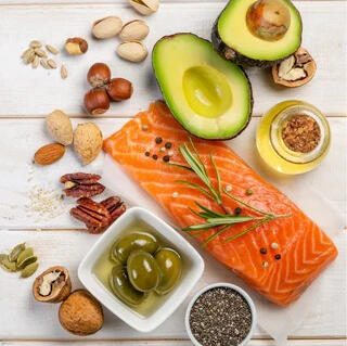 Healthy fats like avocado, salmon, and nuts that support hormone balance and energy